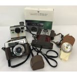 4 vintage cameras.