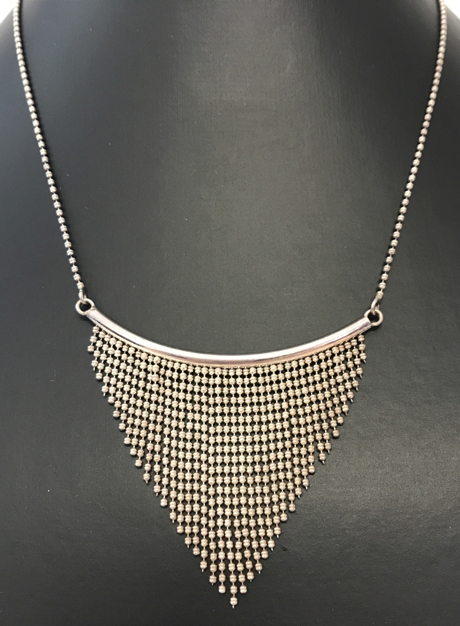 A modern design necklace marked with scales and 925 on fixings and clasp.