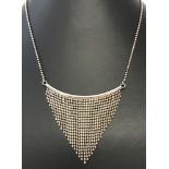 A modern design necklace marked with scales and 925 on fixings and clasp.