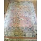 A vintage Chinese pure wool rug. In pastel pink & green tones, with dragon design.