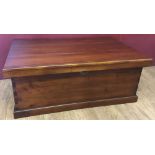 A large late 20th century mahogany coloured wooden chest.