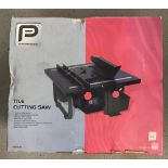 A boxed and unused Performance Power Tools 600W tile cutting saw.