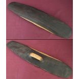A small hand carved Mulga wood Aboriginal parrying shield.