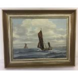 An oil on board framed painting of two sailing boats.