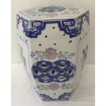 A Chinese hexagonal ceramic stool with pierced detail to sides and top.