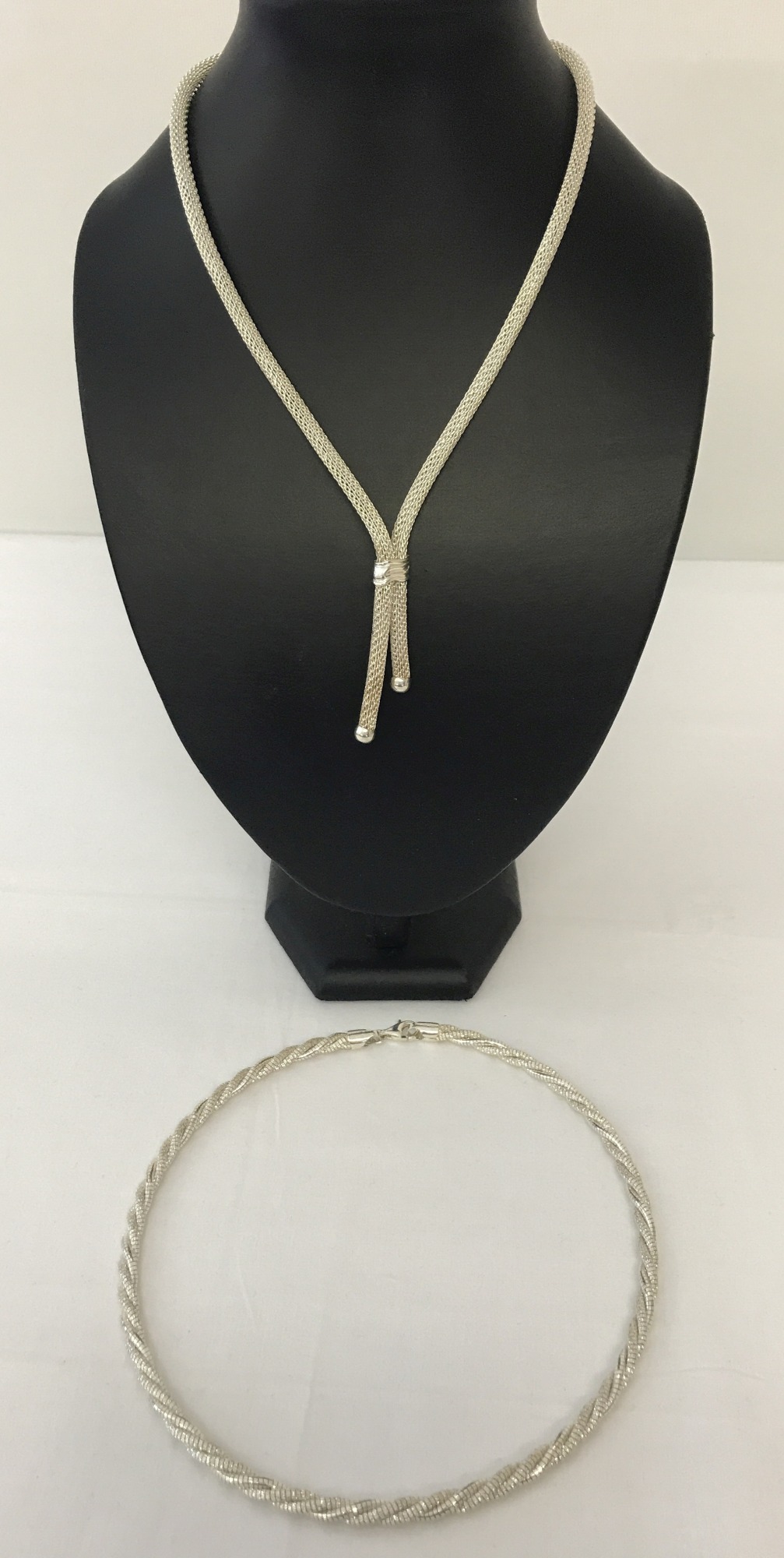 2 modern design necklaces in new condition.