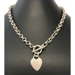 A heavy belcher chain with front T bar fixing and dangle heart pendant.