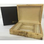 A boxed Birdseye maple jewellery box by Walwood.