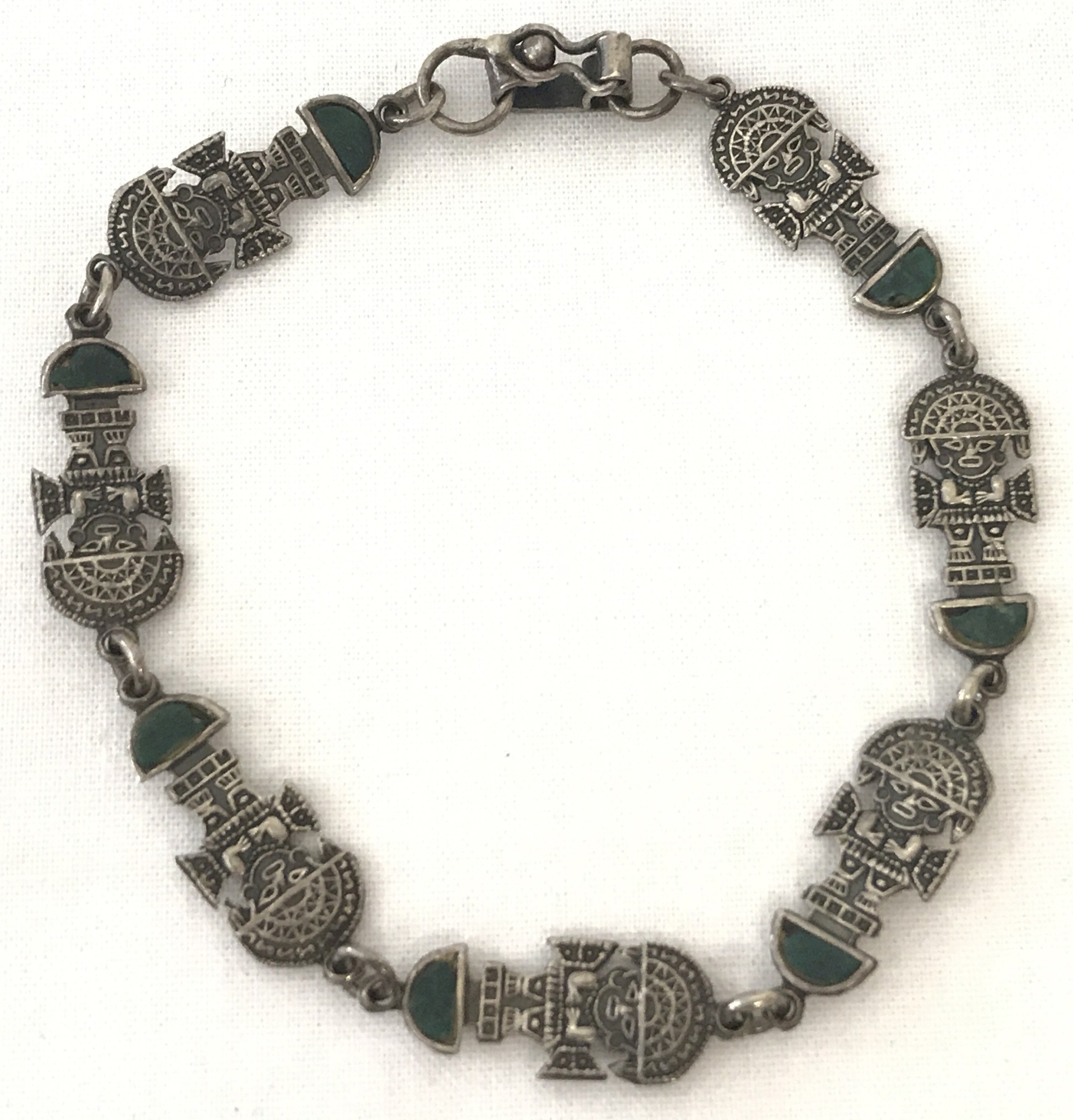 An Aztec style bracelet set with pieces of malachite. Marked to back of clasp 925.