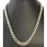 A decorative multi link silver necklace.