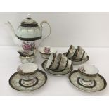 An Imperial bone china 6 setting coffee set with floral design & pale green and black banding.