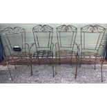 A set of 4 large wrought iron garden chairs.