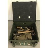 A 1980's military air cylinder box containing an assortment of misc. vintage tools.
