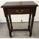 A modern solid wood mahogany-coloured hall table.