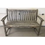 A vintage wooden slatted garden bench.