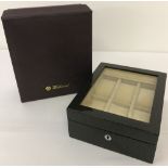 A new boxed Walwood watch box in a geometric design and high gloss finish.