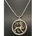 A silver circular pendant with lion detail on a white metal rope chain.