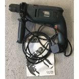A Black & Decker 'twistlok' mains hand drill, complete with instructions.
