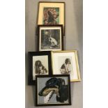 A collection of 5 framed pictures of dogs.