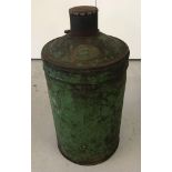 A vintage 25 litre Castrol Limited circular oil can painted green.
