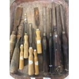 A quantity of vintage wooden handled carpenters and wood turning chisels.