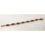 An oval link amber bracelet with lobster clasp.