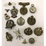 A collection of Military badges and cap badges.