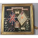 A framed and glazed mid to late 19th Century wool work panel of The Suffolk Regiment.