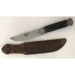 A vintage German K55 Kaufmann fixed blade knife with Chapaya Askari leather sheath.