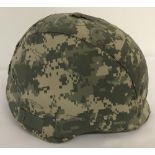 A US PASGT helmet with ACH chin strap and cover.