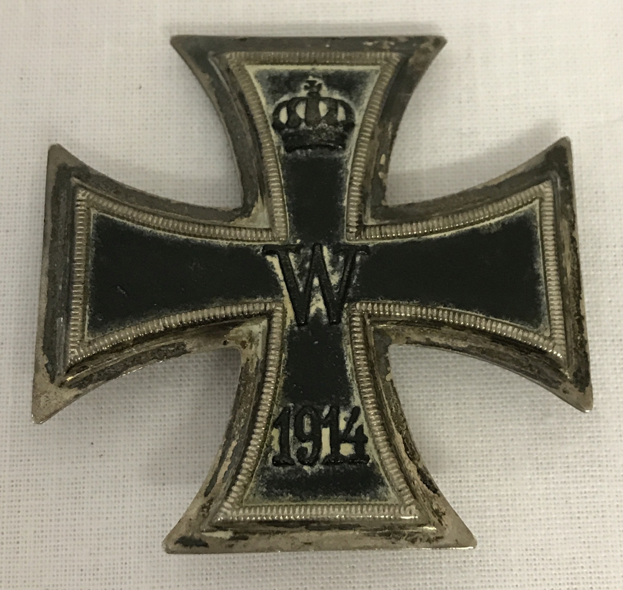 A WWI Iron Cross dated 1914. Pin to reverse is missing.