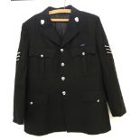 A wool police jacket complete with buttons and Cambridgeshire Constabulary lapel badges.
