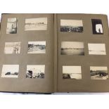A vintage scrapbook containing WWII military and social history photos.