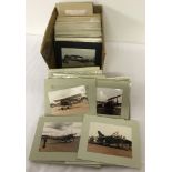 A box of mounted photographs of assorted Aircraft, mostly Military. Approx. 139 in total.
