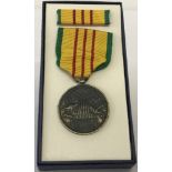 Boxed Vietnam War Style Service Medal and ribbon bar.