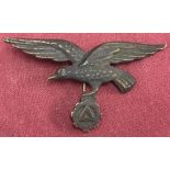 WW2 Style Three Pronged Badge. Depicting bird above cog with triangle inside.