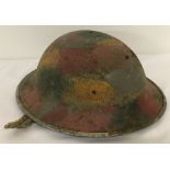 A British Mk II Steel helmet c1940 with hand painted camouflage detail.