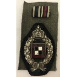A boxed WW1 Style Imperial German/Prussian Observers badge and medal ribbons.