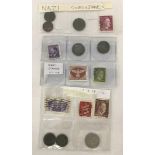 A collection of German Nazi coins and stamps.