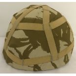 A British MKGA combat helmet worn by Lt. I. Fairbairn TA.