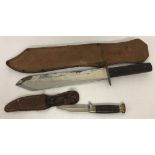 2 vintage knives in leather sheath's.