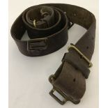 A WWI era leather belt with brass buckles.
