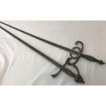 A pair of vintage ornamental lond bladed swords with floral decoration to blades.