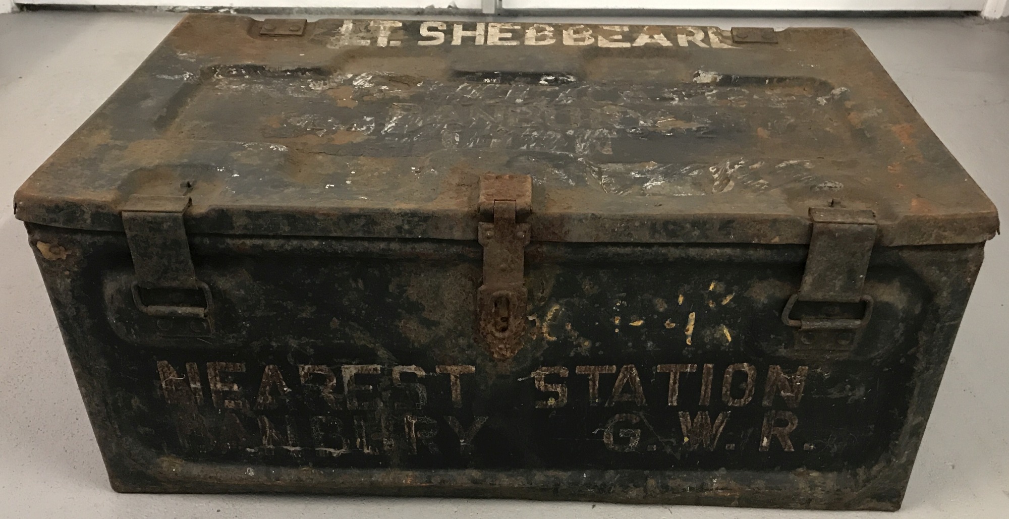 A military tin trunk marked Lt. Shebbear, Broughton Castle, Banbury Oxon.