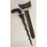 A vintage wooden handled Indonesian/Java Kris dagger with wooden scabbard.