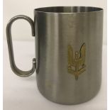 A Stainless Steel tankard with brass S.A.S "Who Dares Wins" badge on front.