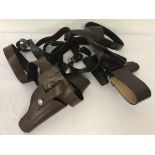 A quantity of assorted leather belts; Sam Browne's and holsters.