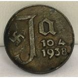 WW2 Style Campaign pin back badge. Marked “Ja 10.4.1938”.
