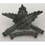 WW1 Style Canadian Machine Gun Corps Cap Badge.