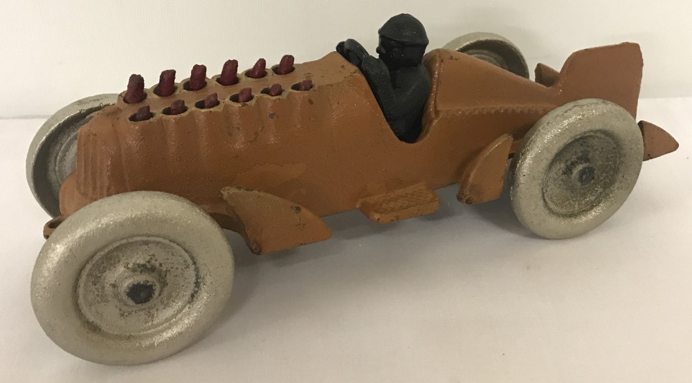 A cast iron moving piston racing car, with moving parts.